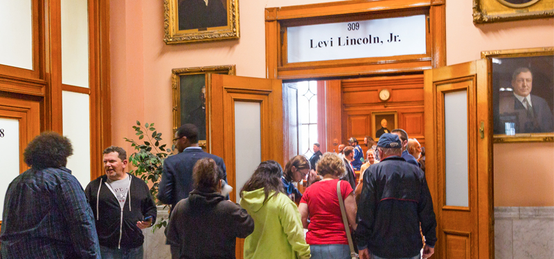 Group of People in Line Heading Into Levi Lincoln Chamber at City Hall