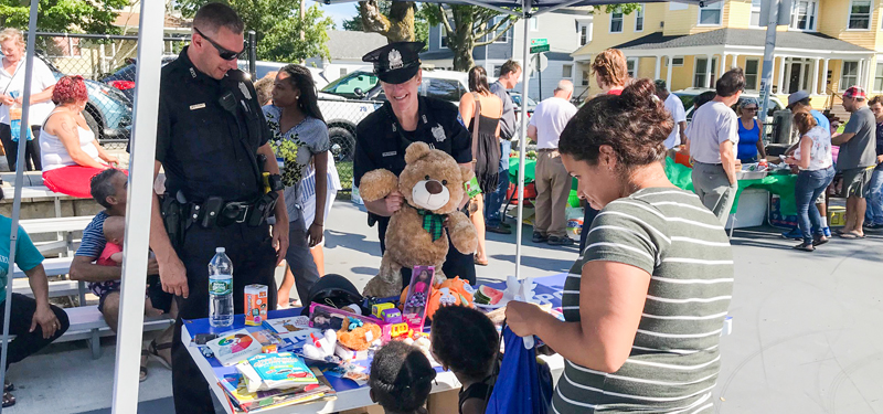 Two Officers at a Display Table During a Neighborhood/City Event