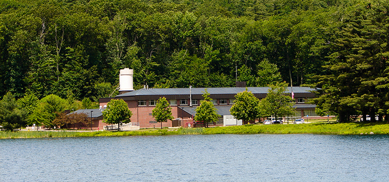 City of Worcester Water Treatment Plant in front of Trees Looking Across the Holden Reservoir