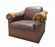 Old Broken Brown Armchair as an Example of Bulk Waste