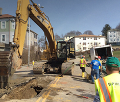 DPW&P Workers Digging a Trench in a Street