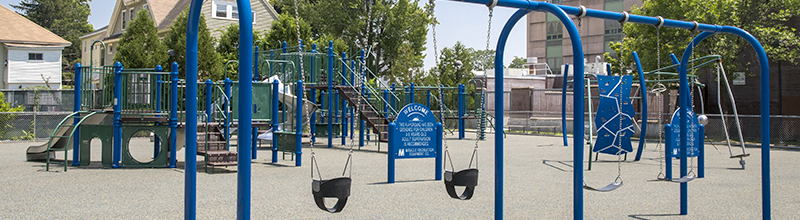 Swings in Foreground and Playground Structure Behind at Bennett Field