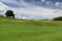 Looking Uphill to the Club House and American Flag Pole from a Fairway - Click to Enlarge