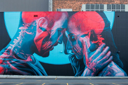 Mural on Brick Wall of Couple Embracing