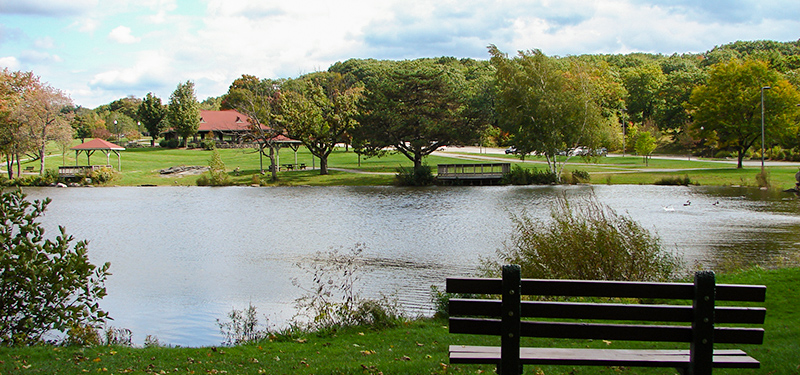 Green Hill Park Pond and Pavilion from Behind a Park Bench
