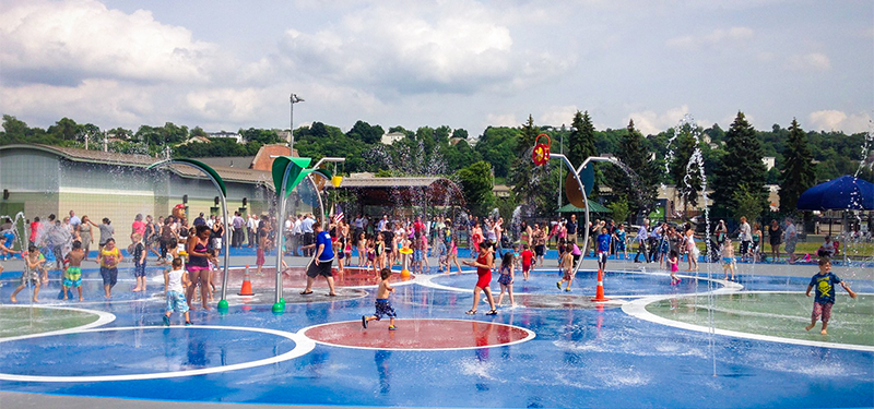 Large Group of Kids and Families Playing at the East Park Spray Park
