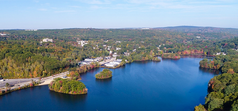 Coes Pond Aerial View with Water Below and Trees on the Skyline