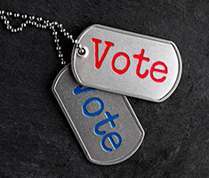 Two Dog Tags with the Word Vote on Each