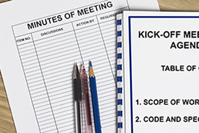 Minutes of Meeting Chart Paper with Pens and Pencil on Top