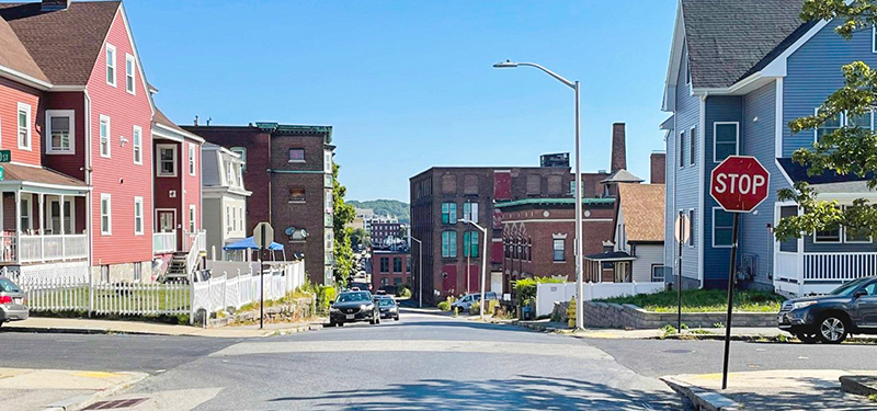 Beacon Street Intersection with Stop Sign and Buildings in Background