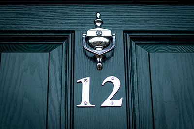 Black Door with Silver Number 12 on it