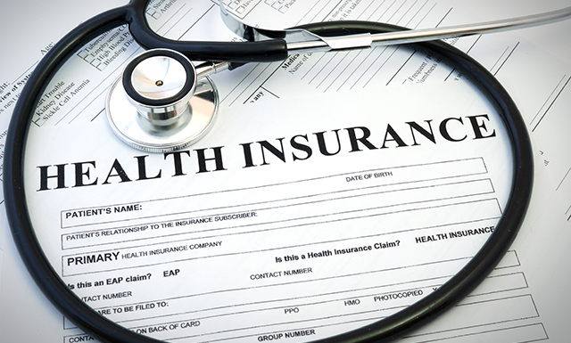 Health Insurance Form on Table with Stethoscope