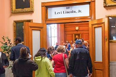 Group of People in Line Heading Into Levi Lincoln Chamber at City Hall