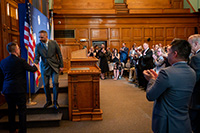 City Manager Leaving Podium with Audience Giving Standing Ovation