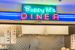 Close Up of the Blue Neon Sign Above the Lunch Window at Bobby M's Diner