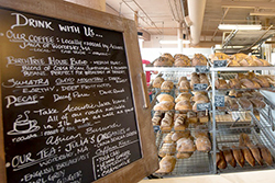 Bakery with Chalkboard Menu and Display Case of Baked Goods