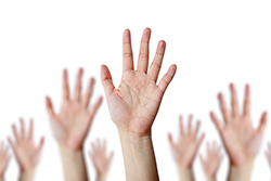 Group of Hands Raised in the Air