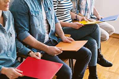 Young Adult with a Folder and Notebook