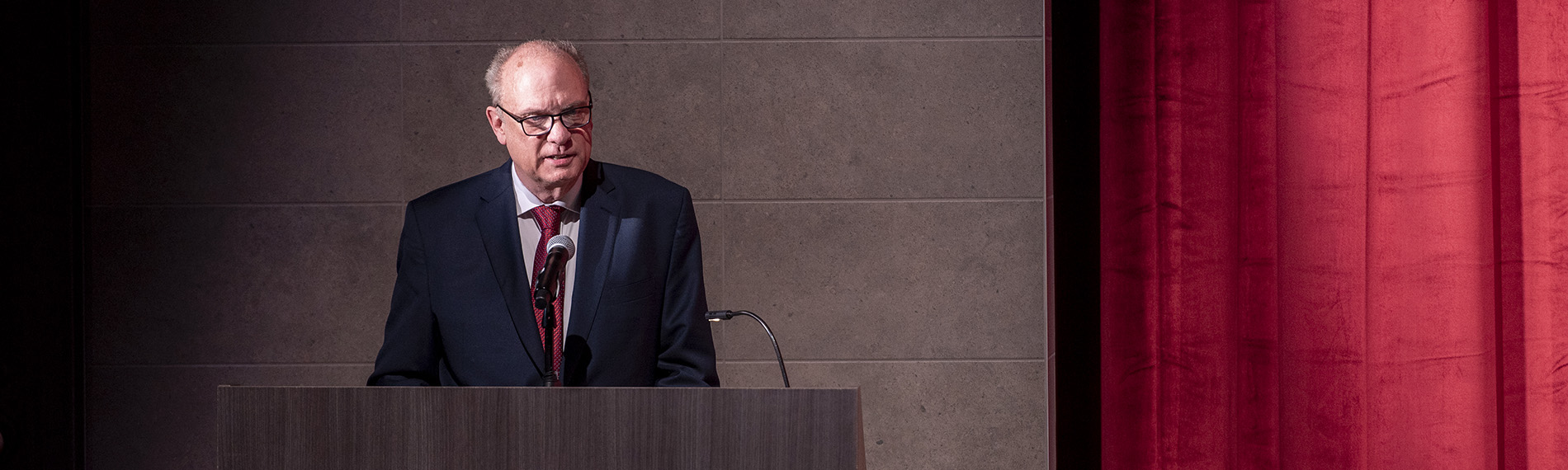 Mayor Petty Speaking at a Podium