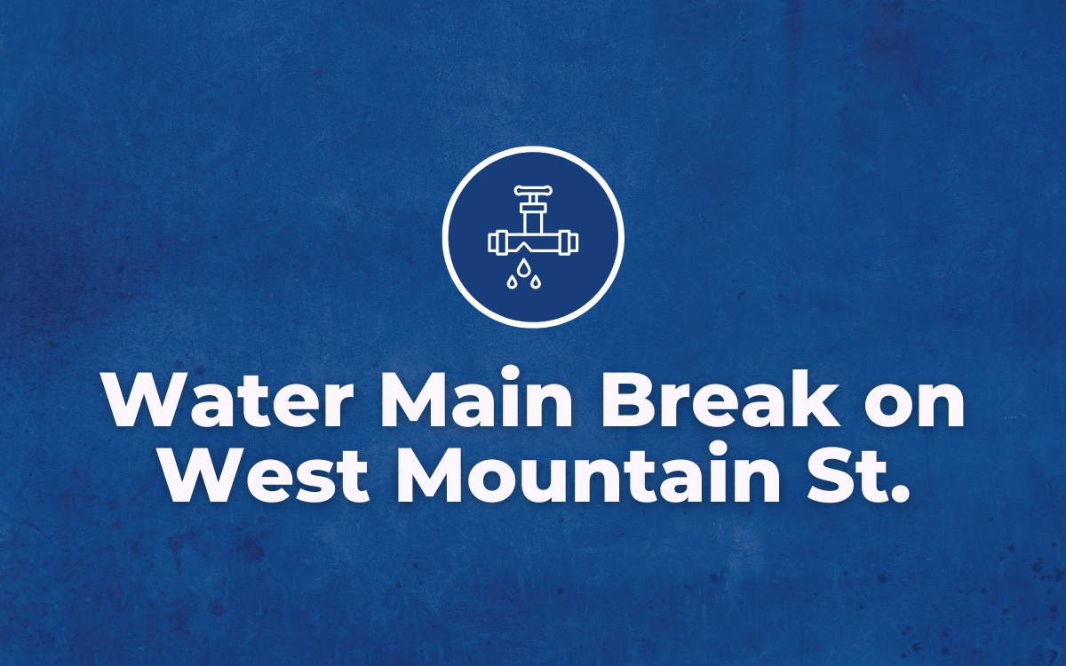 Blue background with white text overlayed that reads, "Water Main Break on West Mountain St."