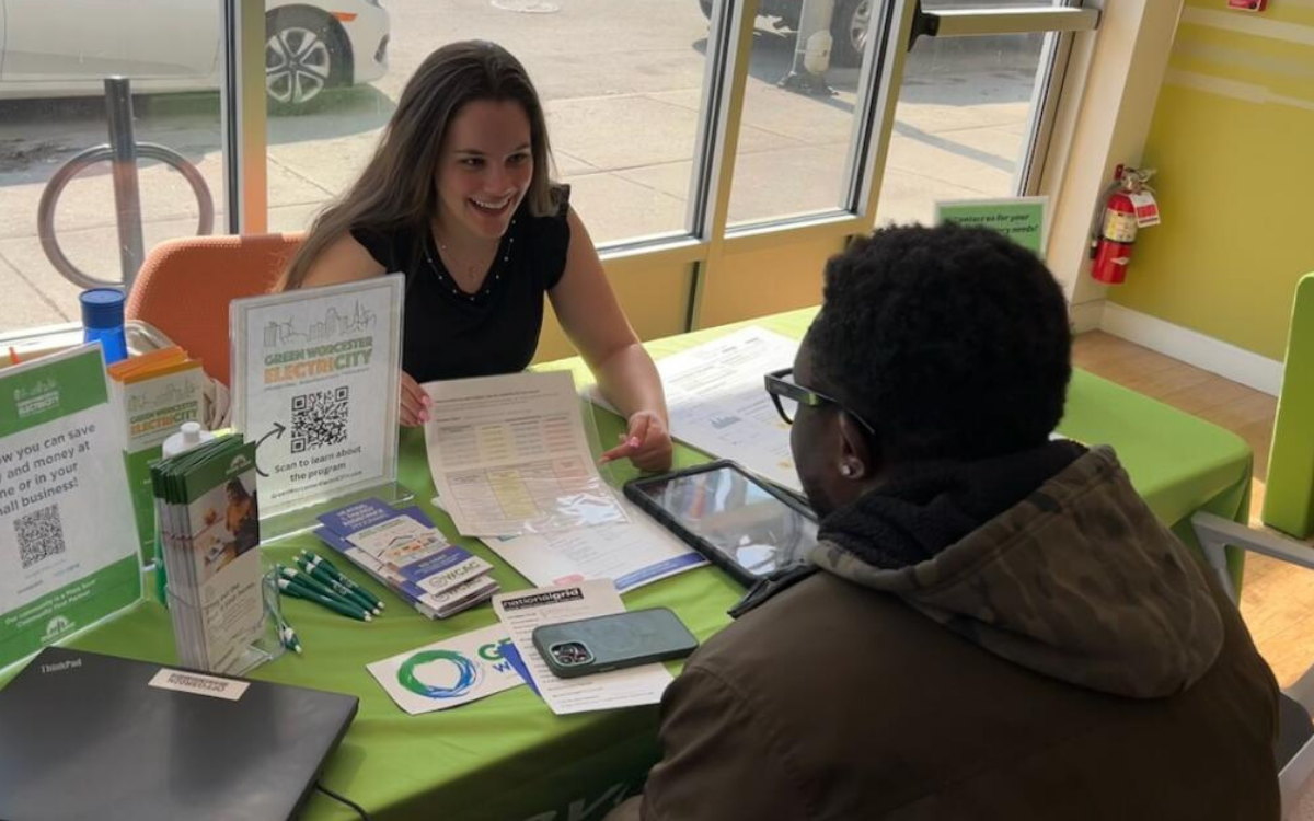 Photo of a resident receiving advice from an Energy Advocate