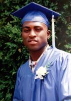 Headshot Photo of Andre Edmonds in Graduation Cap and Gown